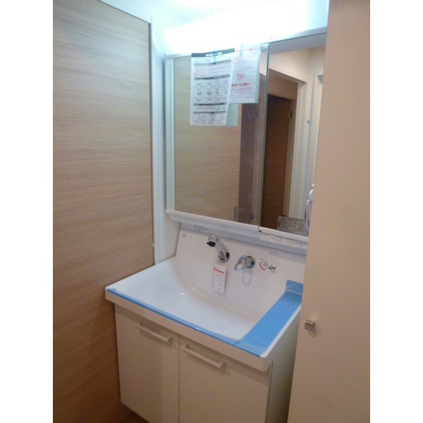 Washroom. It is a photograph of the 202 in Room