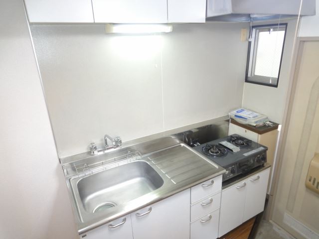 Kitchen. Next to the kitchen is a small window with