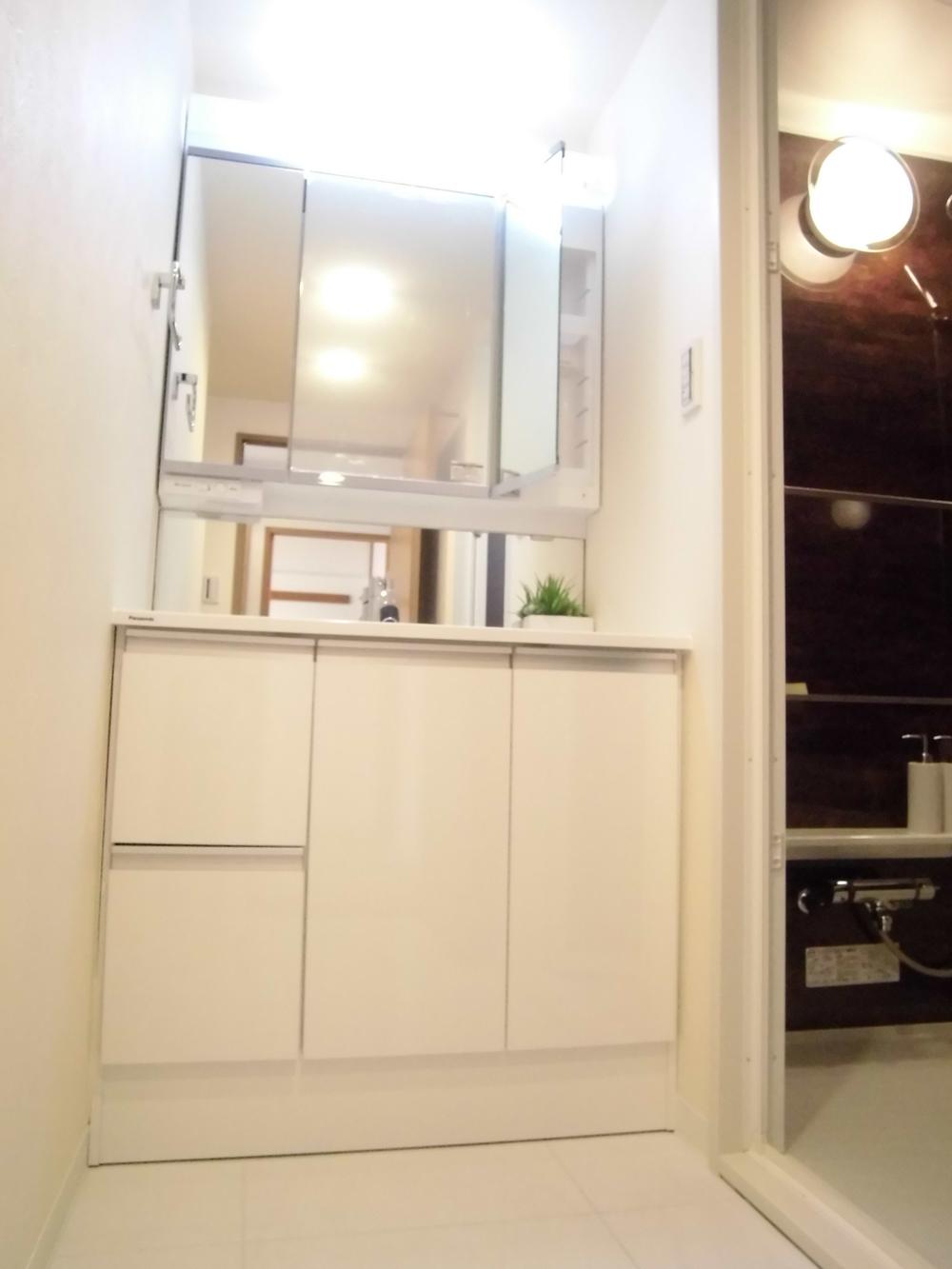 Wash basin, toilet. It is the washroom