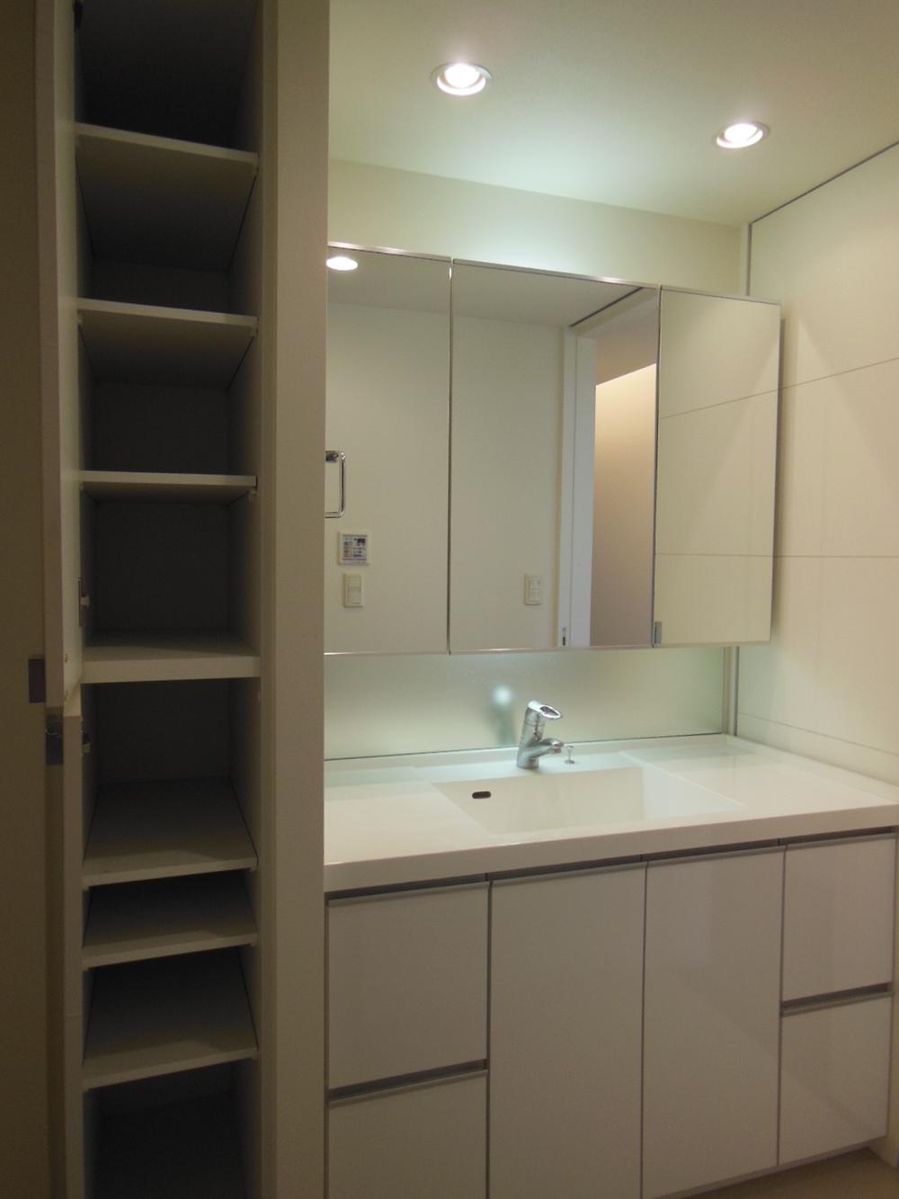Wash basin, toilet. The left side of the vanity, Linen cabinet has provided storage capacity is.