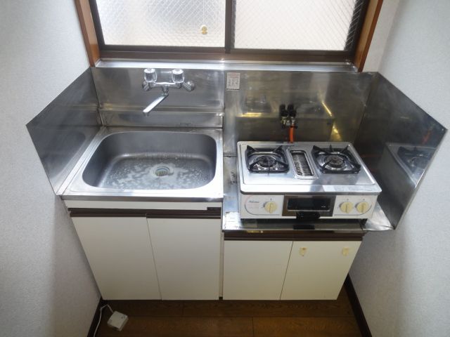 Kitchen. It comes with 2 lot gas stoves! ! 