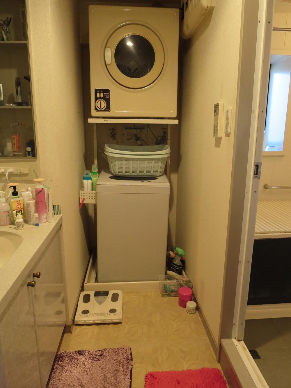 Wash basin, toilet. There is a ventilation fan in washroom