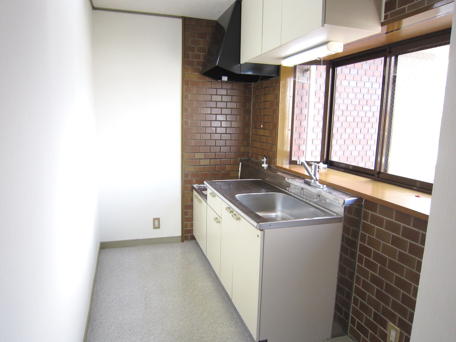 Kitchen. There is a window in the kitchen.