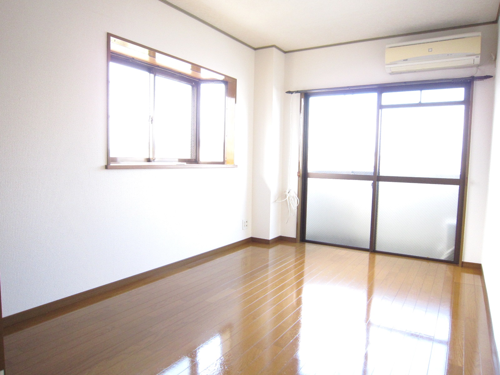 Living and room. It is a bright room with two-sided lighting.