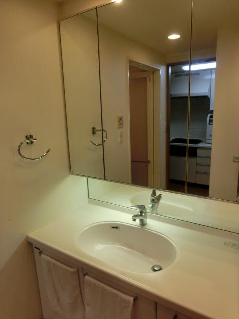 Wash basin, toilet. Since there is indirect lighting, It is a calm atmosphere.