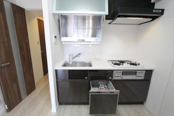 Kitchen. A kitchen with a dishwasher to help the household chores of wife!