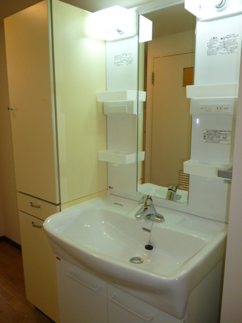 Washroom. There is also a linen purse next to the vanity. 