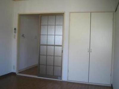 Living and room. There partition in neatly kitchen and the room