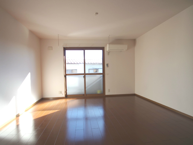 Living and room. Same building, It is a photograph of the same floor plan of the room.