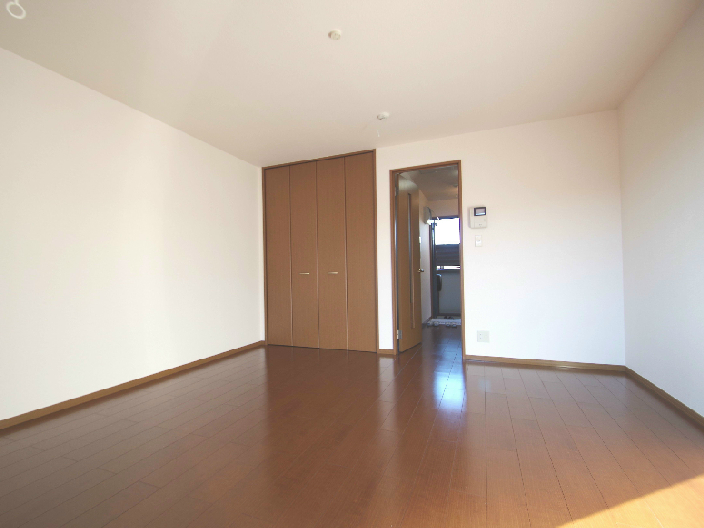 Other room space. Same building, It is a photograph of the same floor plan of the room.