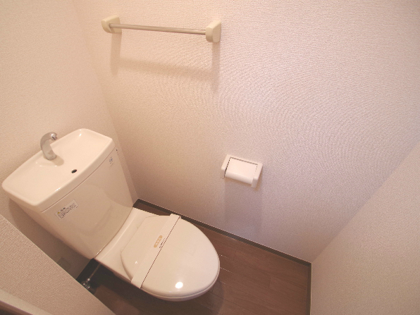 Toilet. Same building, It is a photograph of the same floor plan of the room.