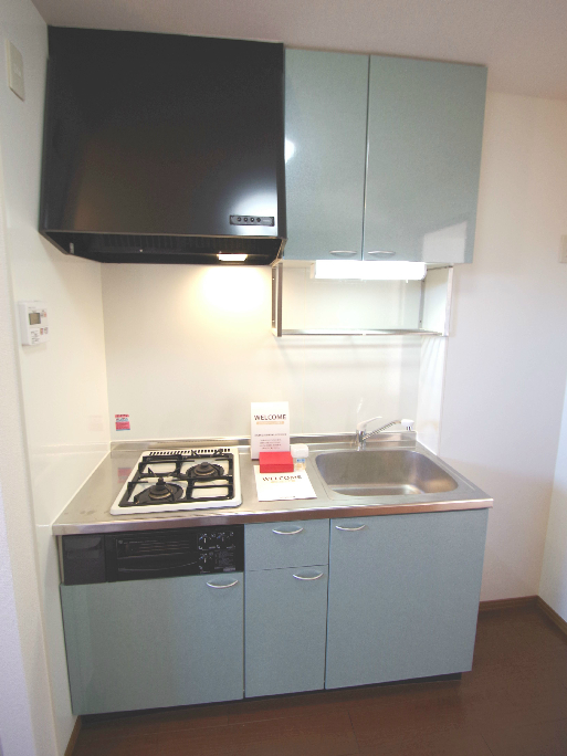 Kitchen. Same building, It is a photograph of the same floor plan of the room.