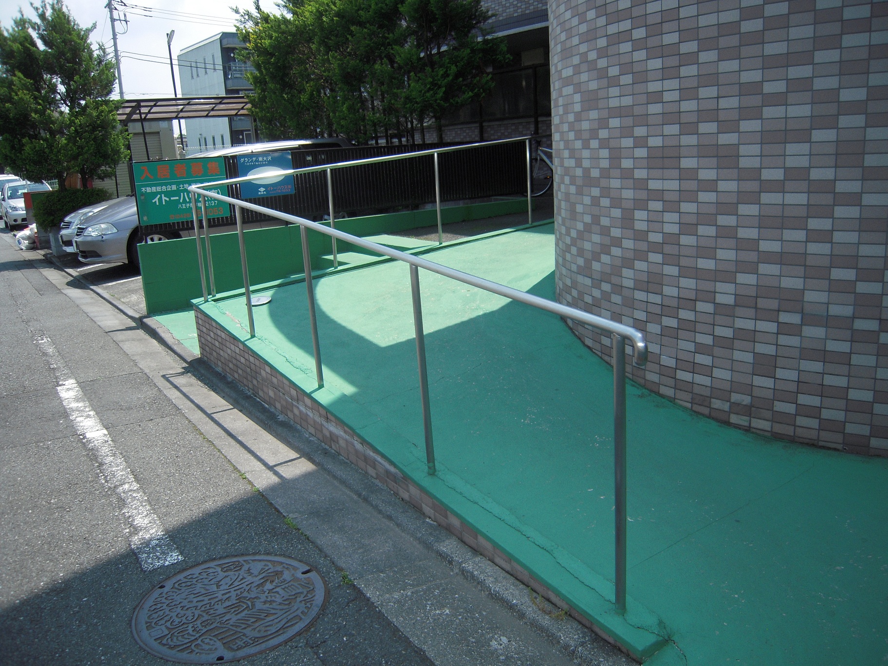 Entrance. Slope is with a handrail