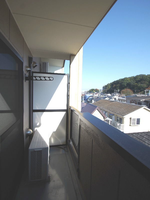 Balcony. It will be a reference photograph of the same building.