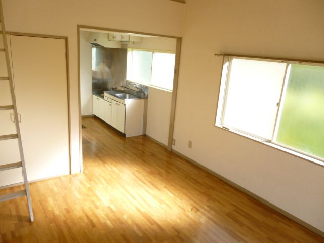 Living and room. With so loft has a higher ceiling