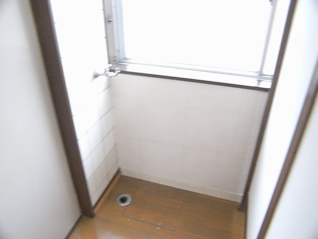 Washroom. Washing machine in the room