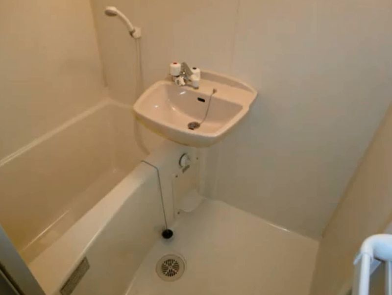 Bath. It is a beautiful bath with a wash basin.