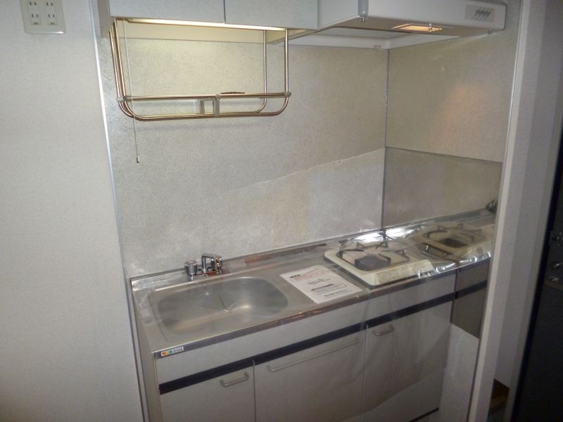 Kitchen. Bite is a gas stove with a kitchen.