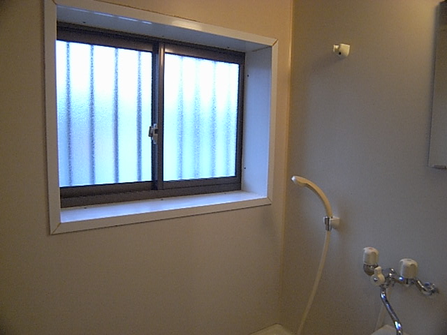 Bath. There is a window on the bus