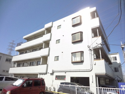 Building appearance. Pasting white tiles there is a feeling of cleanliness