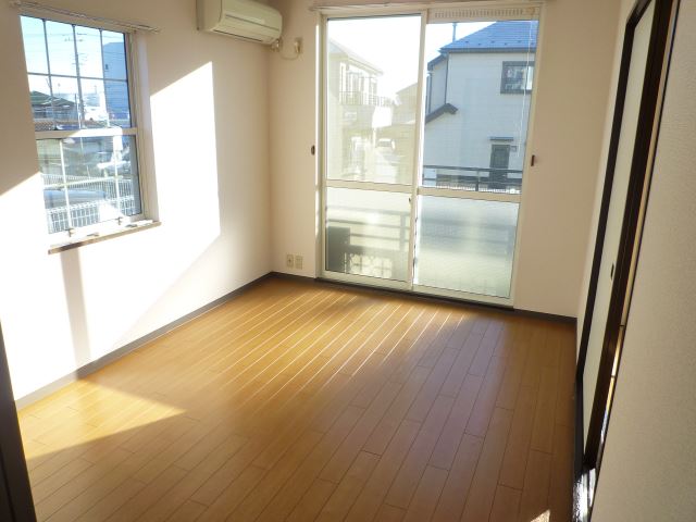 Living and room. It is a bright room with two-sided lighting