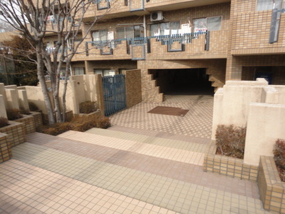 Building appearance. Stylish entrance to the brick-like