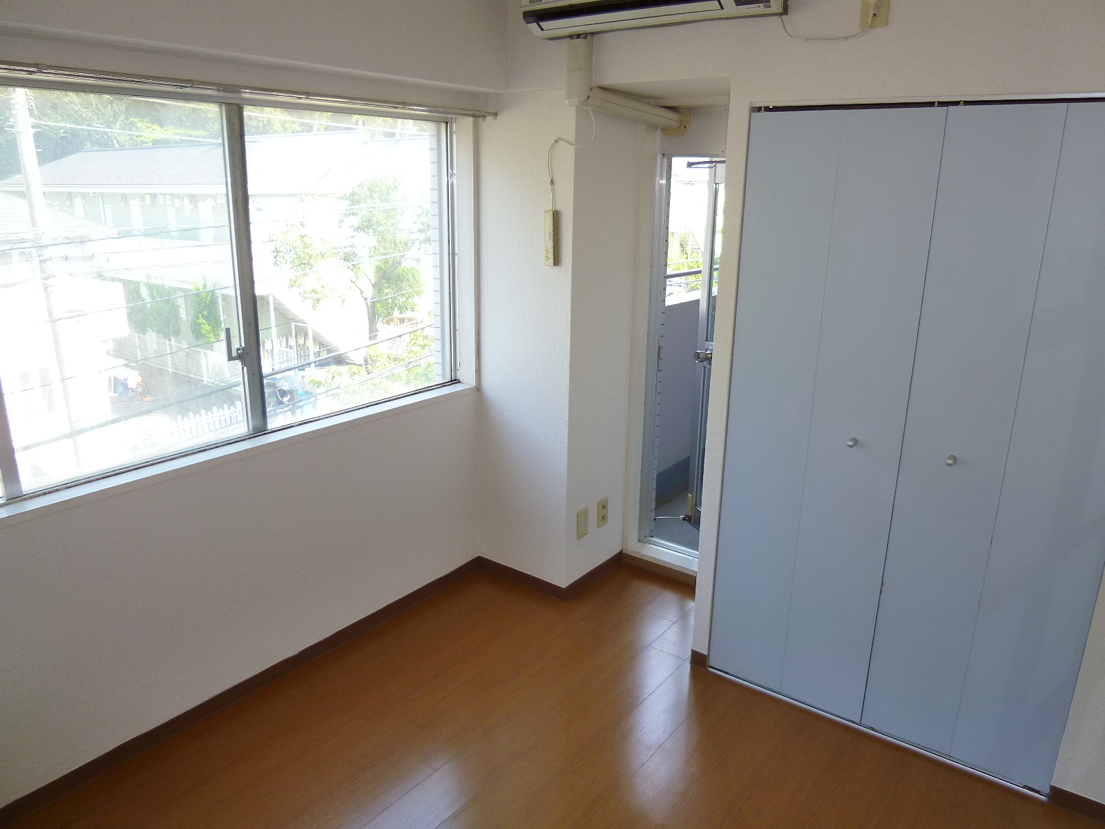 Living and room. There is a closet in the room.