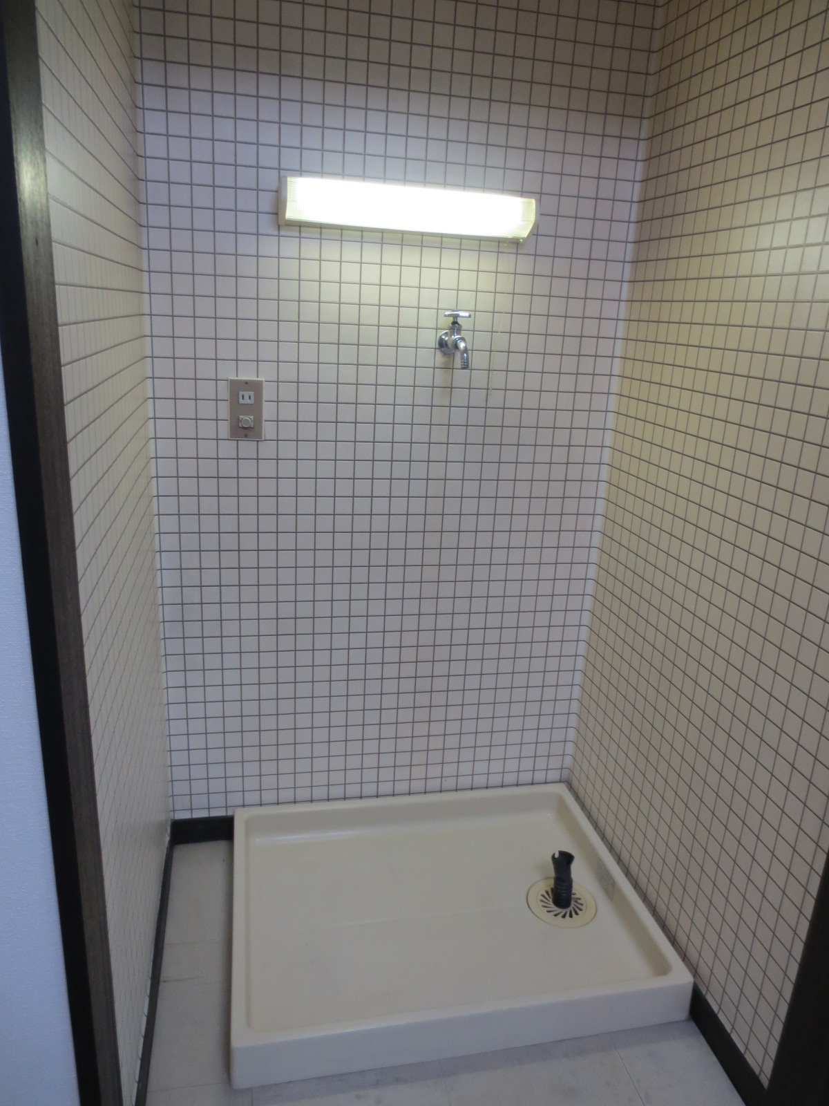 Other room space. Washing machine in the room