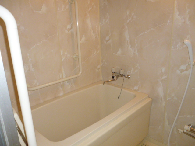 Bath. It is a bathroom with reheating and handrail function.