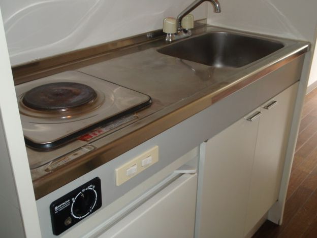 Kitchen. It is a kitchen with a electric stove bite.