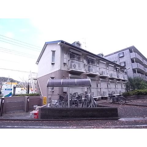 Building appearance. There are bicycle parking lot in front of the eye