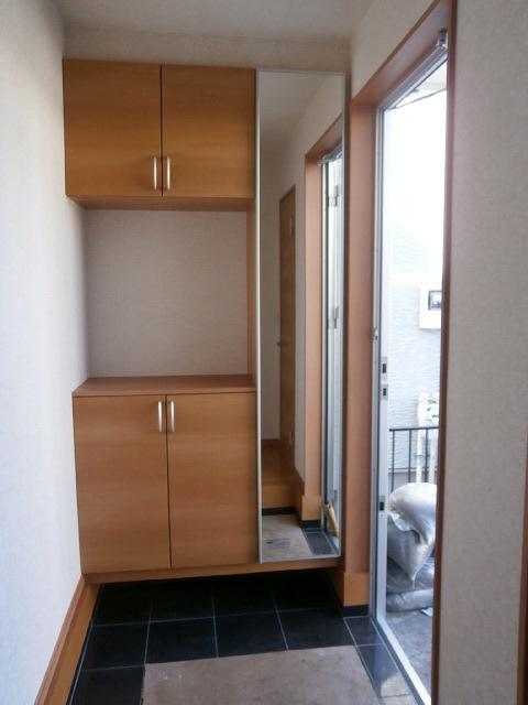 Entrance. Entrance floor natural stone, With cupboard mirror