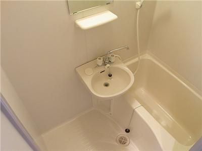 Bath. It is a beautiful bath with a wash basin. 