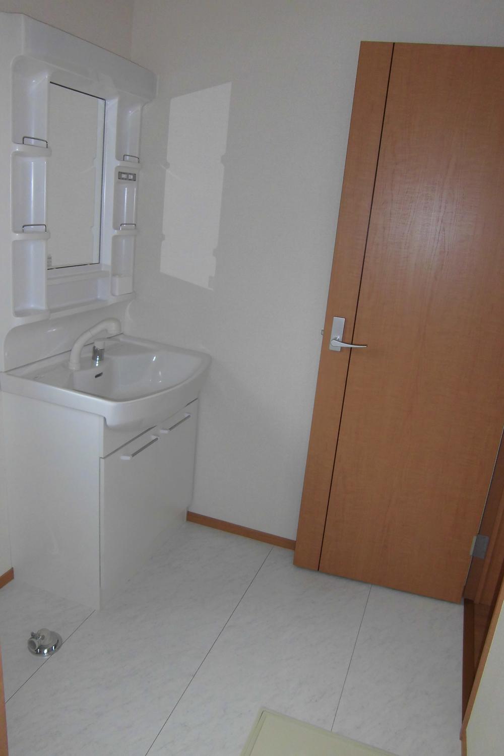 Wash basin, toilet. It is vanity that cleanliness was a white tones.