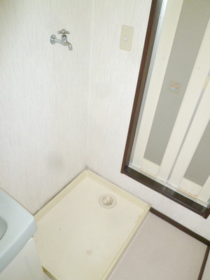 Other room space. Washing machine in the room