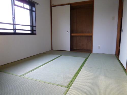 Other room space. It is a photograph of the corner room