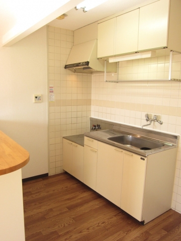 Kitchen. I do not see, There is a refrigerator in the kitchen next to yard