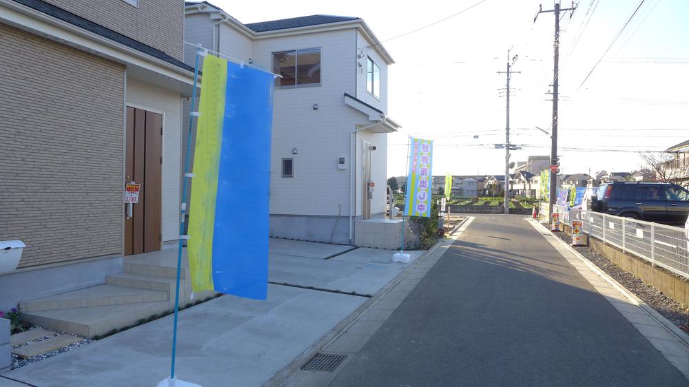 Local photos, including front road. Neatly paved front road. 