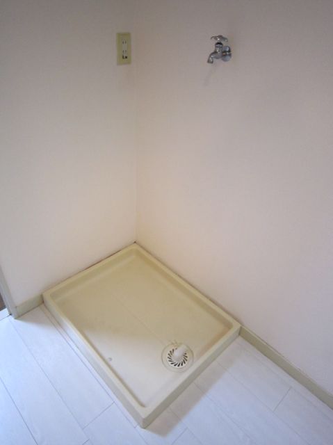 Other room space. Washing machine in the room