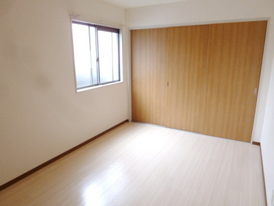 Other room space. Since it is a corner room has windows