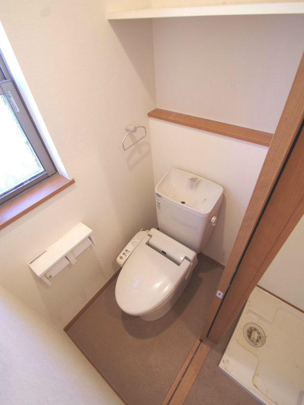 Toilet. Restroom of warm water cleaning toilet seat, which is also ventilation windows and shelves!