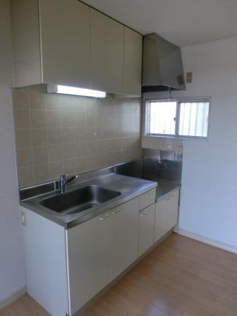 Living and room. There is a window in the kitchen