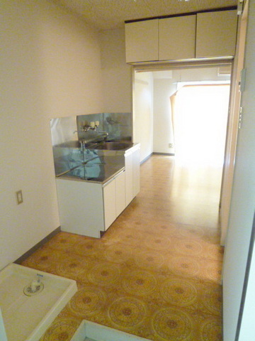 Entrance. There is also housed in the upper part of the kitchen next to