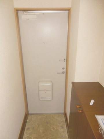 Entrance. Front door storage cupboard