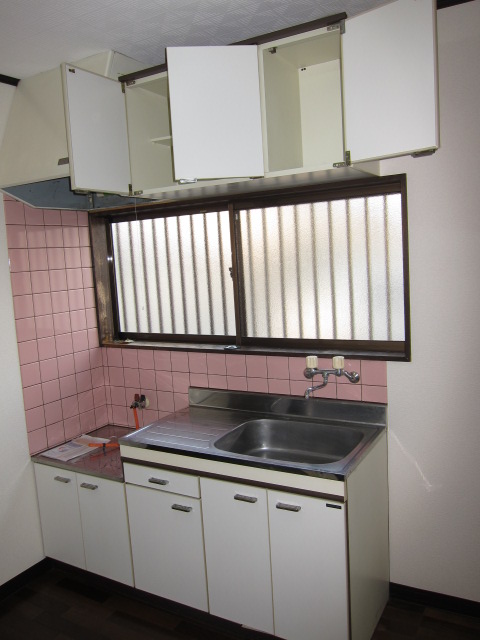 Kitchen. It will be on the corner room type of room photo.