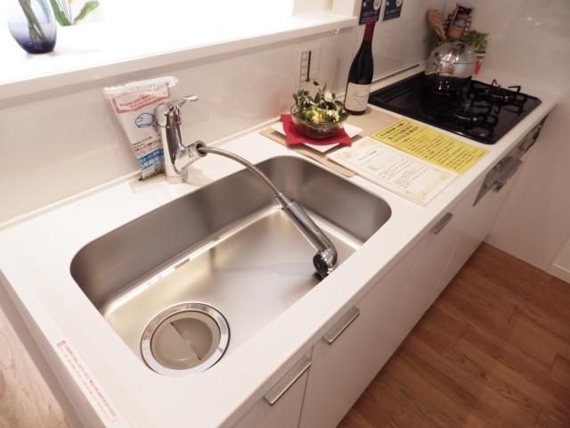 Kitchen. Cleaning is Easy in the shower nozzle faucet.