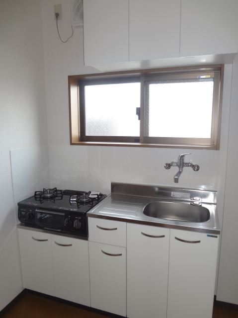 Kitchen. Good ventilation in there Gasukitchin window of the two-burner stove