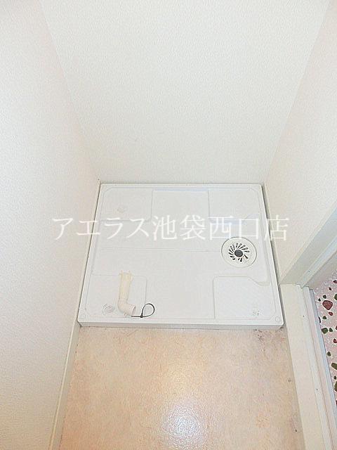 Washroom. Washing machine in the room