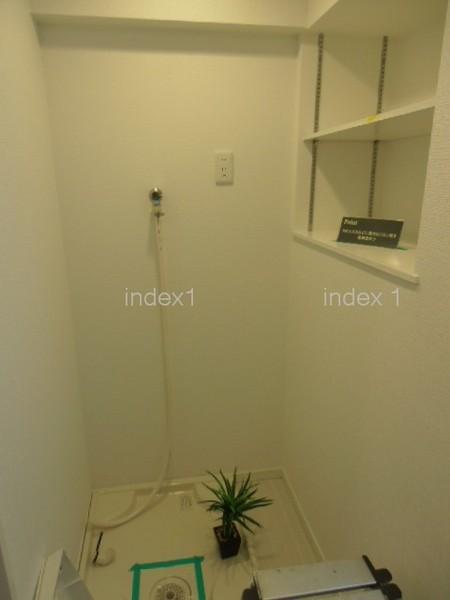 Wash basin, toilet. Laundry Area is located in the washroom