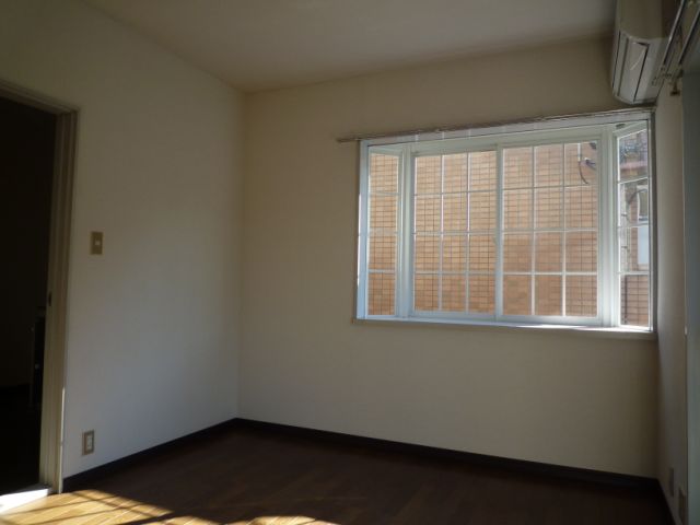 Living and room. It is a photograph of another room